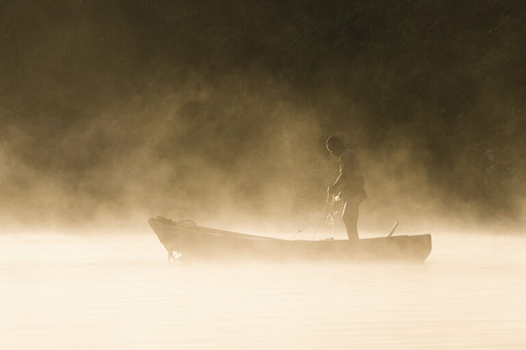 An artisanal fisherman is out in River Nile, Uganda, with the morning mist steaming out. Traditional, artisanal fishing methods like these, used for subsistence do not pose significant threats to the natural resources., Image On the contrary, they make local communities stakeholders to their good health.