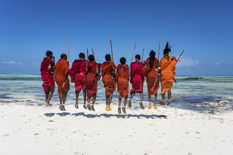 Maasais celebrating the ocean with their traditional jumping dance. In Pongwe, Zanzibar, Tanzania, they are far from their traditional homes in the mountainous areas of southern and western Kenya and northern Tanzania.