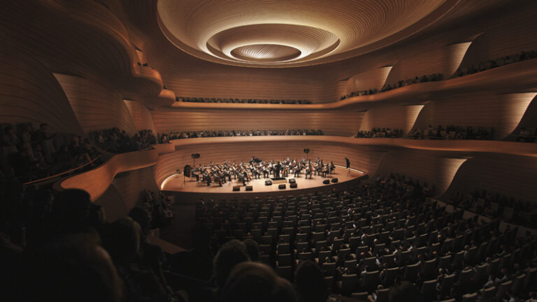 The theatre's performance spaces feature rich timber-lined interiors for optimal acoustics by Bjarke Ingels Group (BIG), Architecture firm, UK