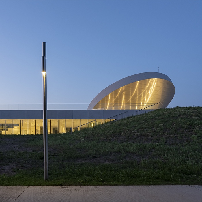 SMAR Architecture Studio tops Lithuanian science museum with solar-inspired disc