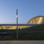 SMAR Architecture Studio tops Lithuanian science museum with solar-inspired disc