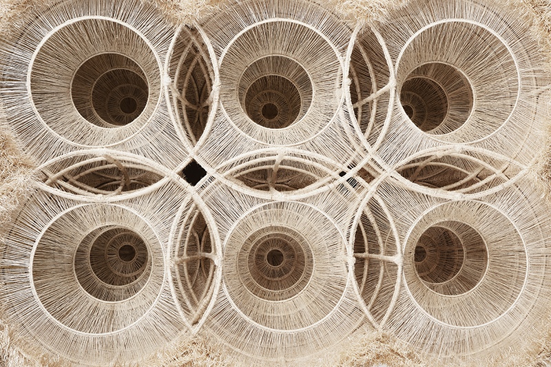 The Waxing and Waning Series 2, 2024 Woven from ramie, China grass cloth, and bamboo, this piece continues the meditative essence of The Entropy Reduction of Hundun, embodying the eternal cycle of yin and yang. The interwoven circles reflect the waxing and waning of energies, the shifting densities symbolize space time's fluidity, and the contrast of textures affirms balance in opposites. A visual journey through cosmic rhythms, it invites contemplation of life's perpetual evolution and dynamic equilibrium by Wanbing Huang