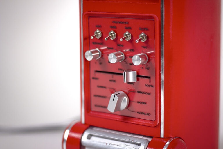 The vibrant red design pays homage to early kitchen computing while embracing a more collaborative future.