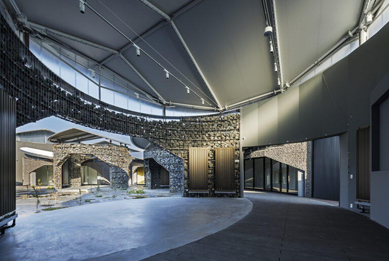 A central courtyard showcasing the biodiversity of reclaimed Yumeshima Island,