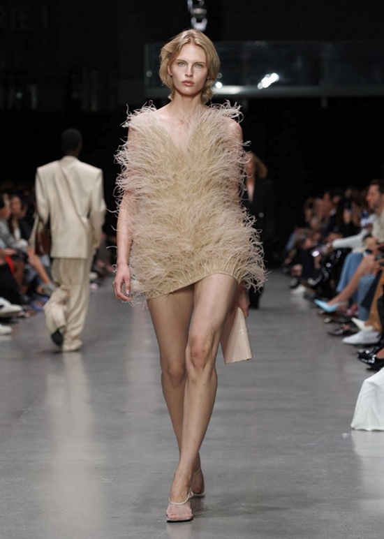 Fevvers material in soft champagne creates dramatic volume on a mini dress at Stella McCartney Summer 2026, showcasing how plant-based innovation can deliver high-impact fashion. Paris Fashion Week.