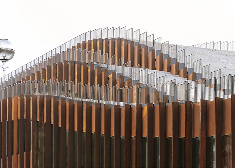 The undulating facade of vertical copper and steel fins gives GOe its sculptural presence while providing solar shading and modulating views