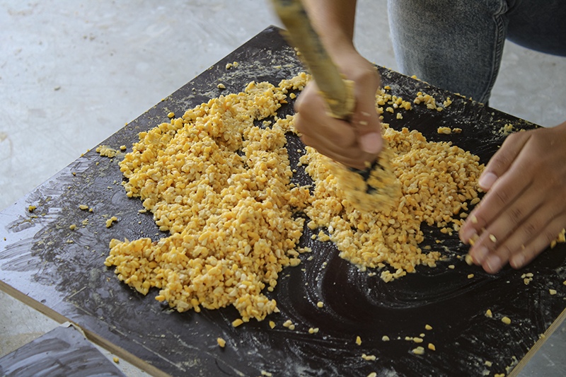 Processing nixtamalized corn waste during material development