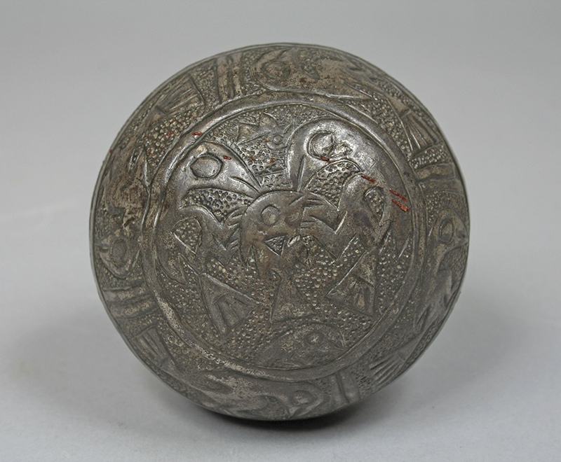 Embossed lead and silver ball depicting seabirds eating a fish