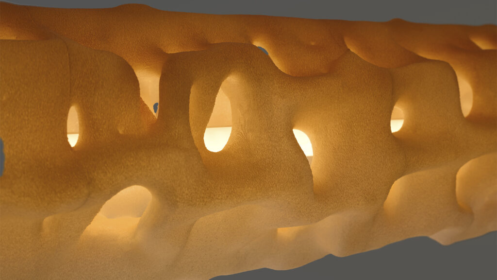 ALHERD pendant lamp, YET FAB. The 3D printed surface glows from within, light finding its way through the computational geometry. Super Playground, Superstudio, Milan Design Week 2026.