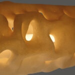 ALHERD pendant lamp, YET FAB. The 3D printed surface glows from within, light finding its way through the computational geometry. Super Playground, Superstudio, Milan Design Week 2026.
