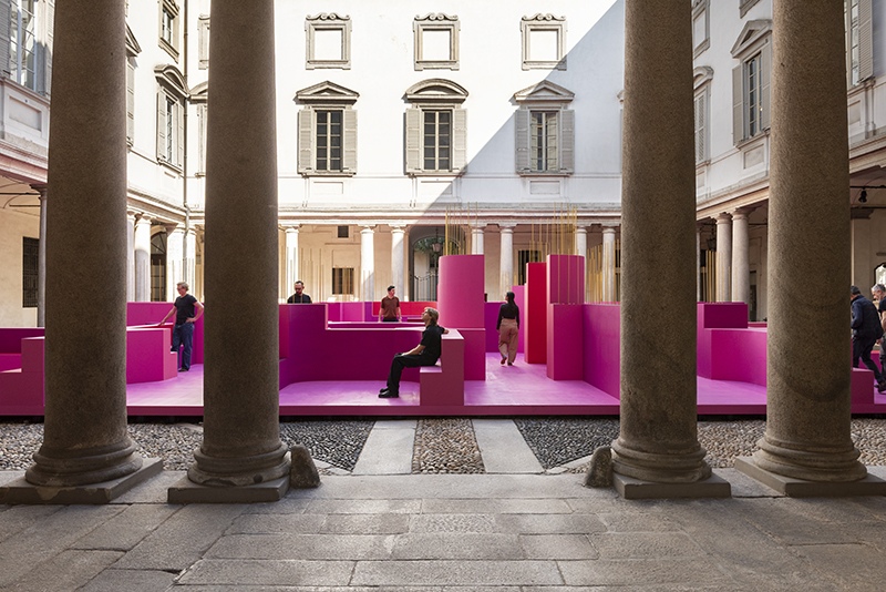 Visitor seated within the installation