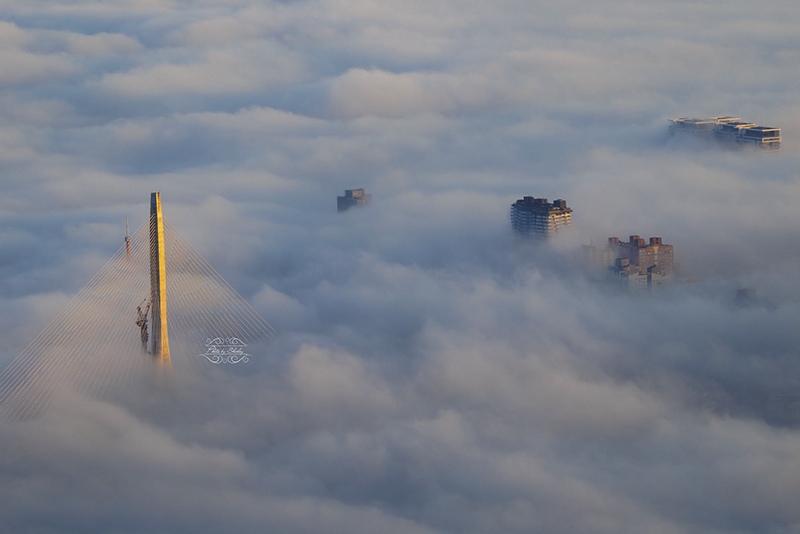 Danjiang Bridge mast above clouds