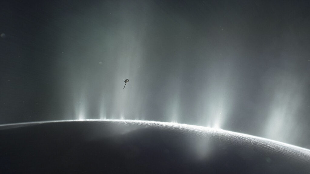 Artist's impression of the Cassini spacecraft flying through the ice plumes of Enceladus, Saturn's moon