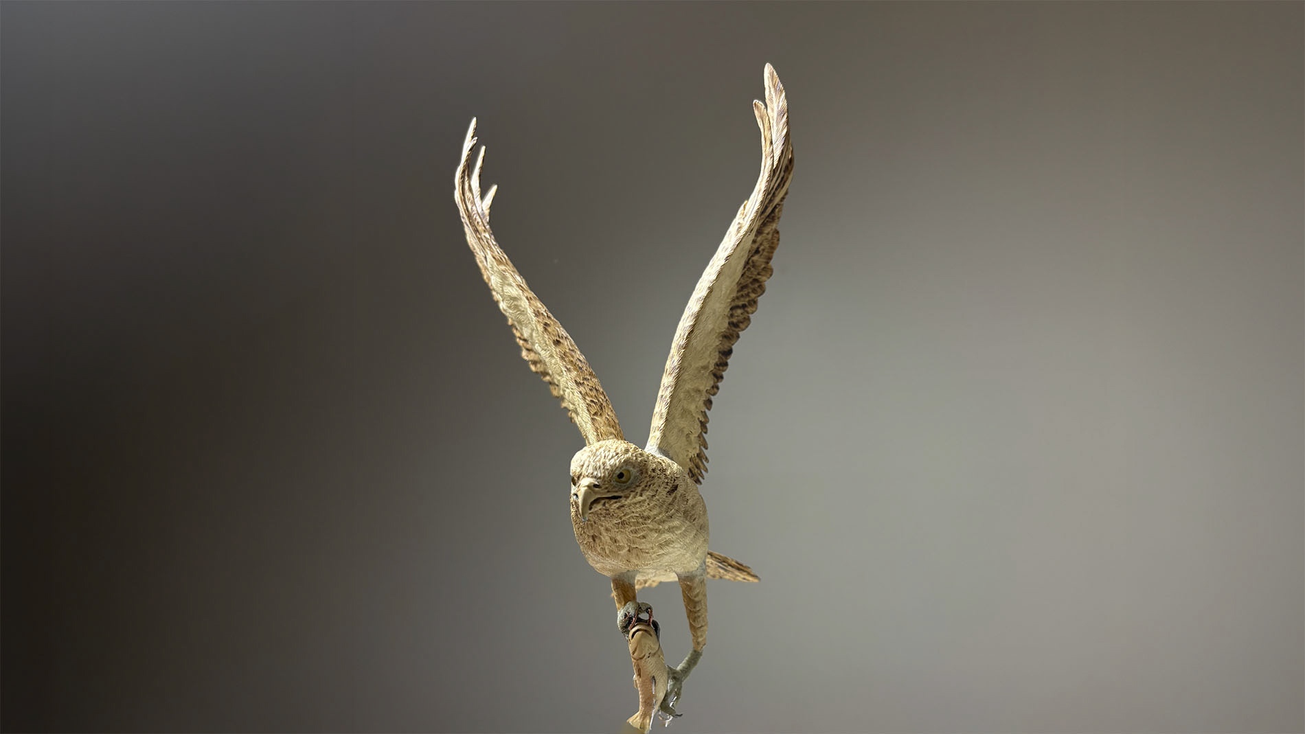 Osprey sculpture in progress, depicting an osprey returning with a freshly caught fish.