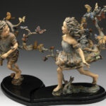 Where Butterflies Lead. Two children run laughing through a swirl of butterflies, bronze
