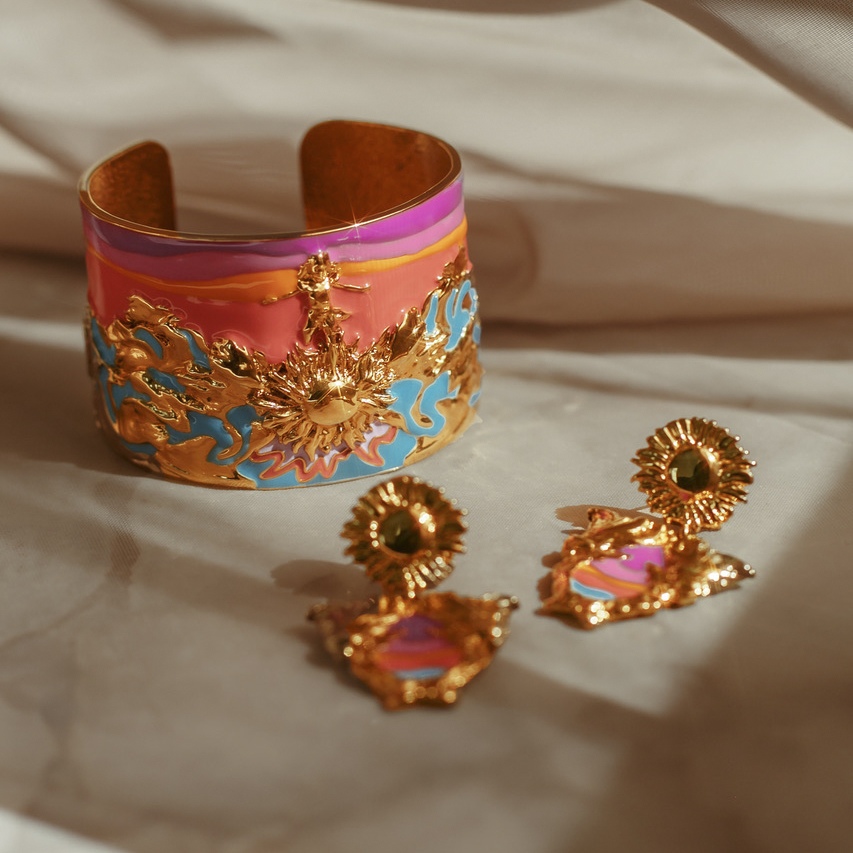 Tomorrow’s Glory earrings, shown with a matching enamel cuff.